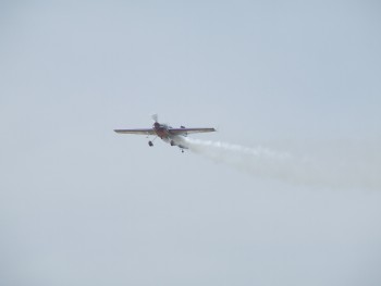 Every one got into the odd attitudes act, but this one had me so shocked last year that I missed the photo. This year I got it. The airplane is flying sideways. The smoke shows the direction of the runway line and his direction of travel... while facing the crowd. For aviators, note the full rudder deflection.