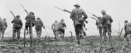 Sadly, I wasn't able to track down the actual clip which has more evidence of fakery but even in this frame the puniness of the barbed wire and the lack of large packs suggest this was shot some distance from the front.